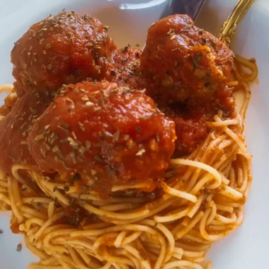 Roasted vegetable meatballs with spaghetti tossed in tomato sauce.