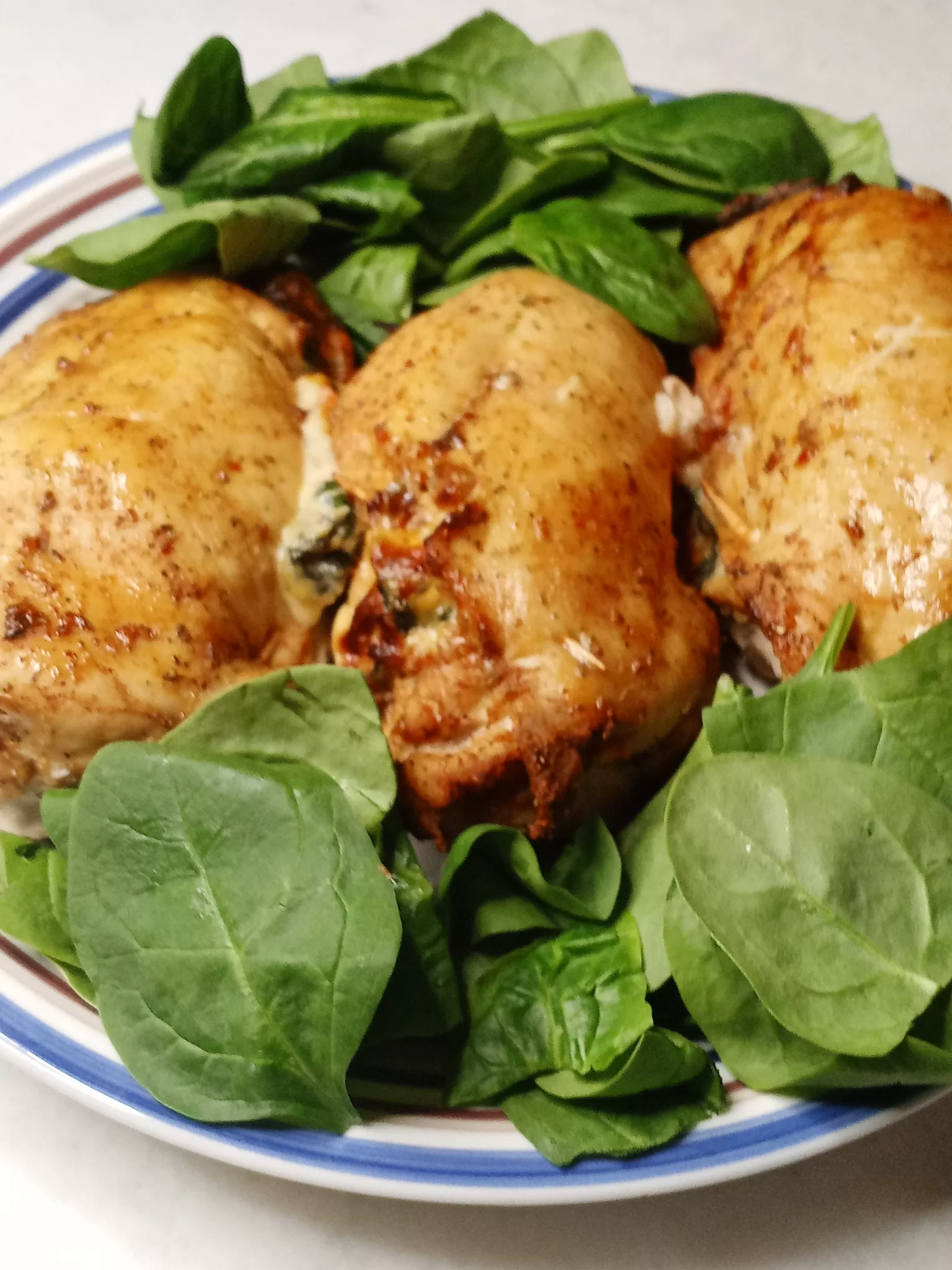 Air Fryer Chicken Breast With Fresh Spinach Leaves
