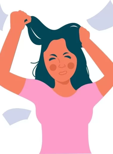 Girl who is pulling out her hair because she is stressed