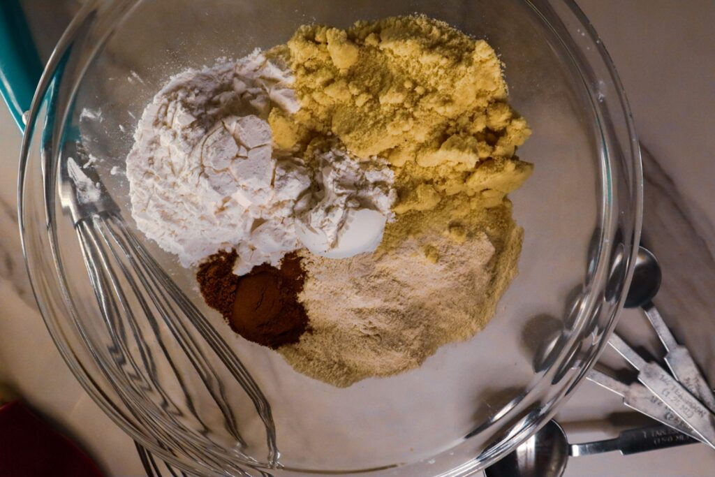 Dry ingredients for banana nut muffins in a bowl.