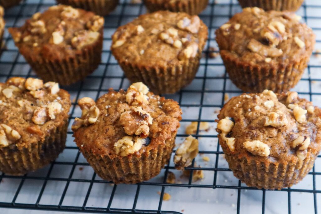 Banana nut muffins on a cooling rack.
