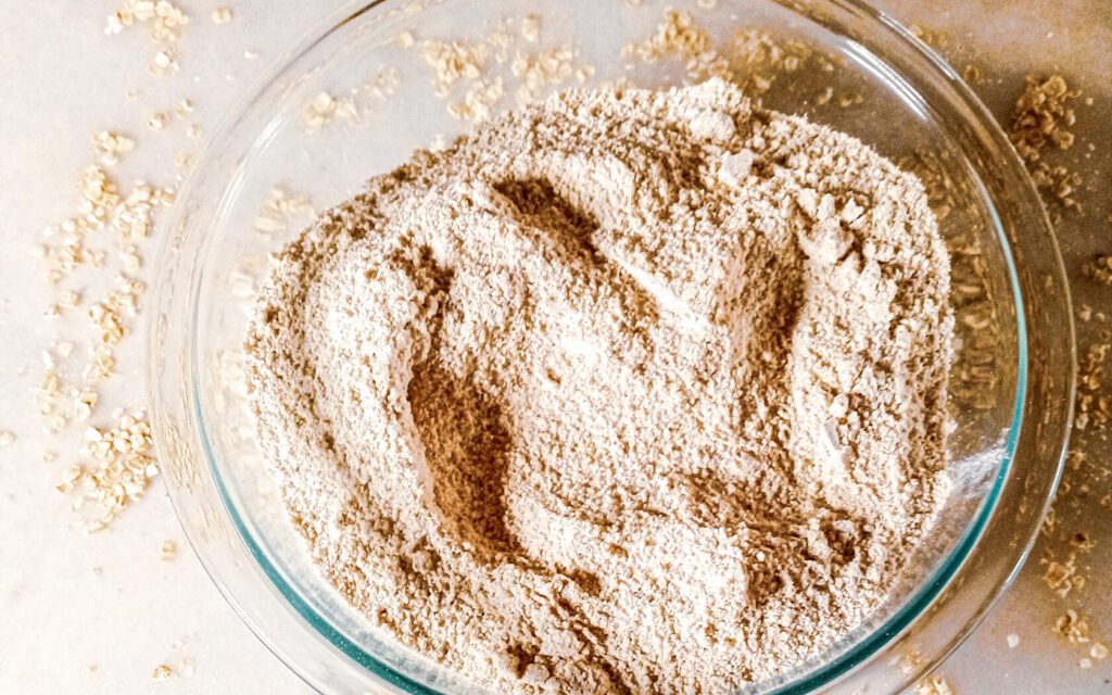 Oat Flour In A Bowl Along With Oats In A Bowl