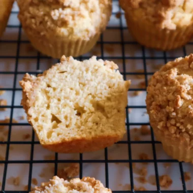 Gluten-free coffee cake muffins on a cooling rack.