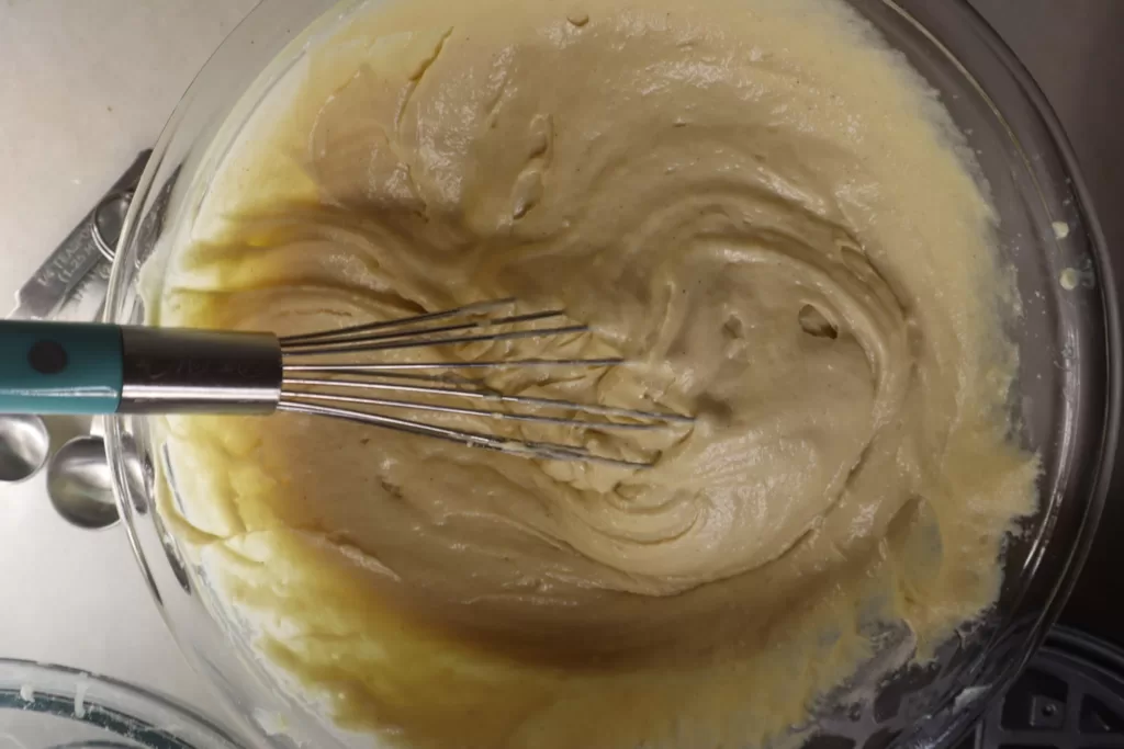 Gluten-free waffle batter in a large bowl.