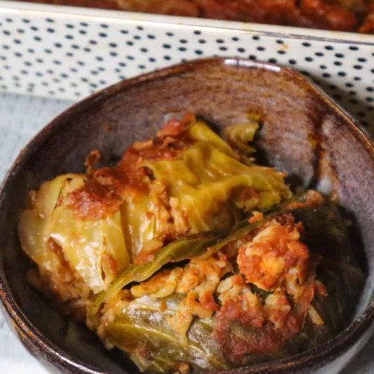 Seafood stuffed cabbage rolls in a bowl.