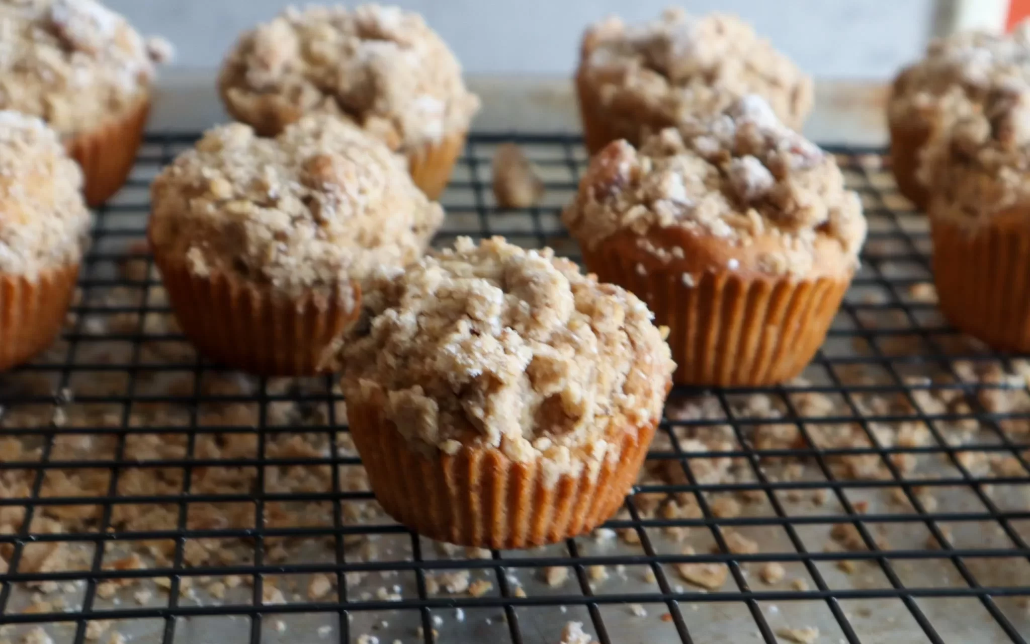 Gluten-Free maple crunch muffins on a cooling rack.