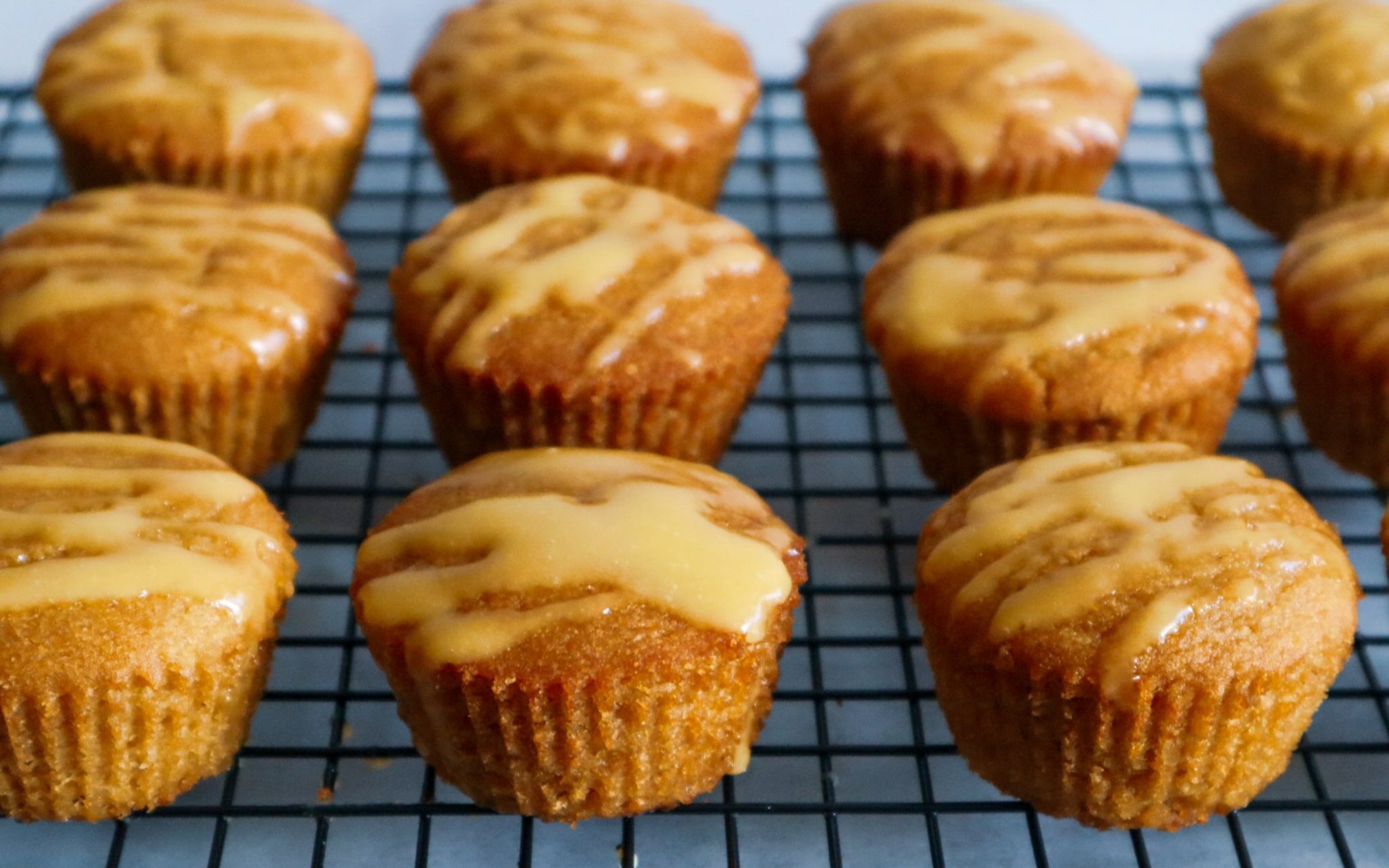 Gluten-free mango muffins on a cooling rack.