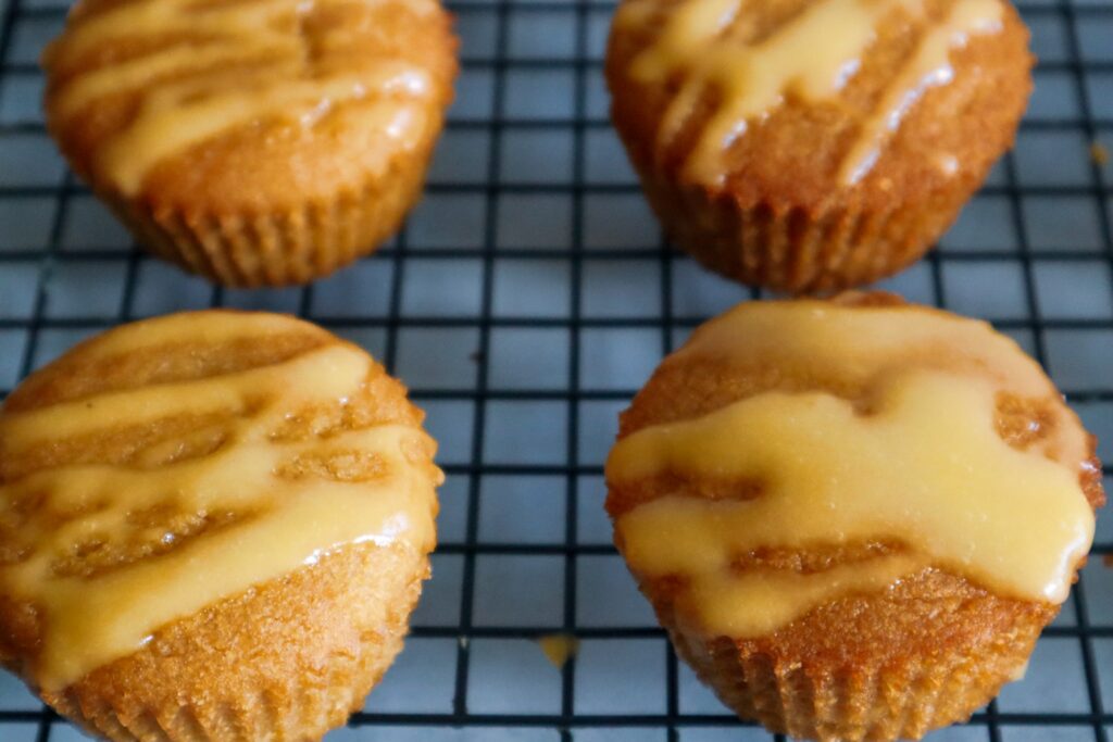 Gluten-free mango muffins on a cooling rack.