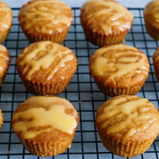 Gluten-free mango muffins on a cooling rack.