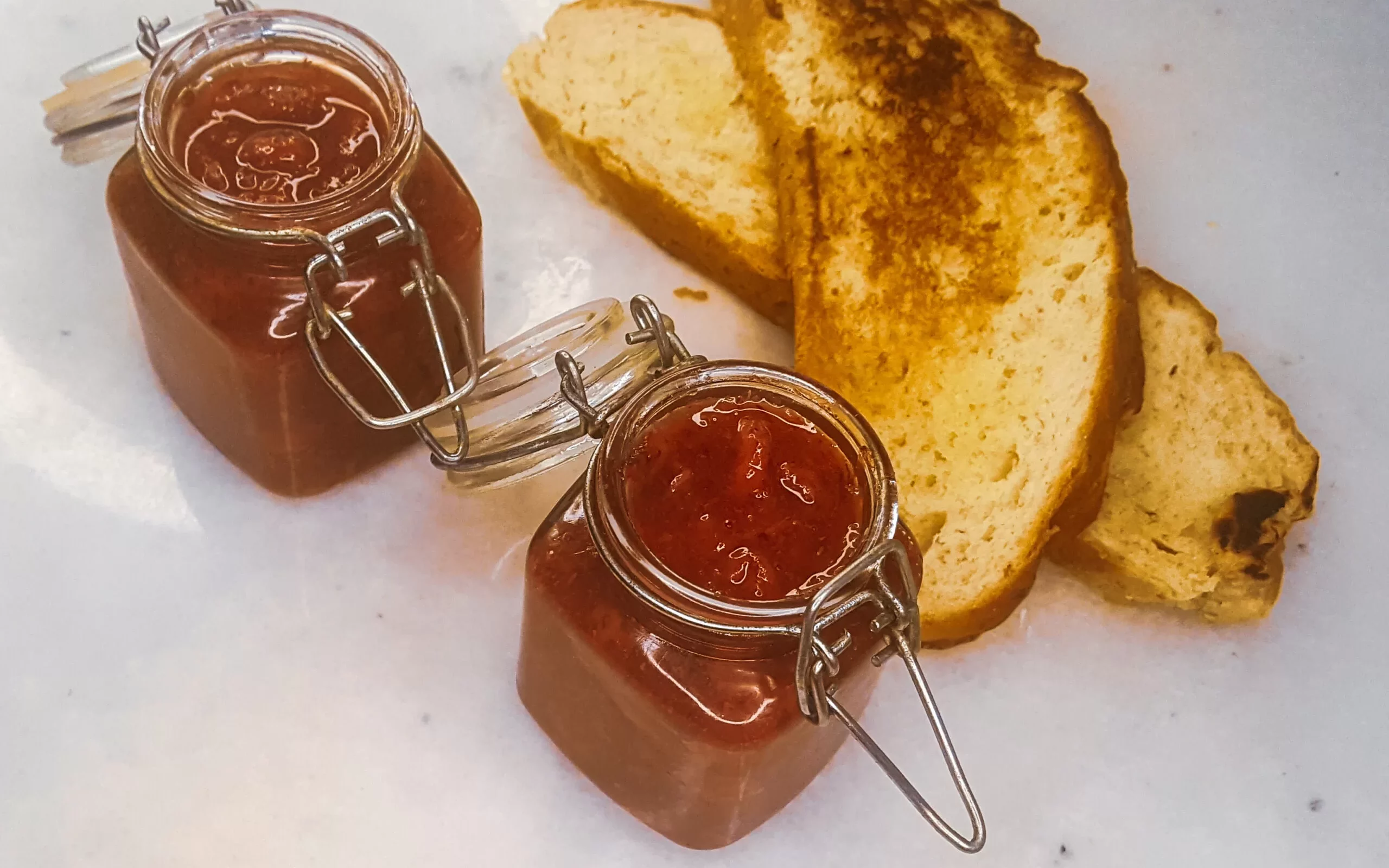 Sugar-free strawberry jam with gluten-free bread.