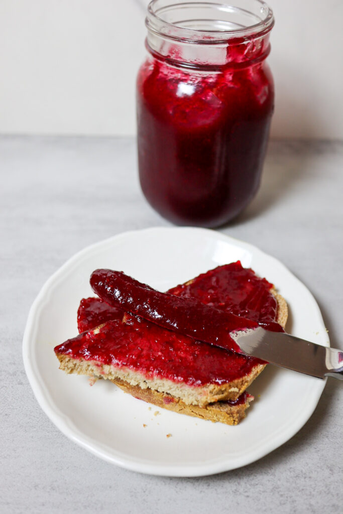 Cranberry jam spread on sourdough bread.