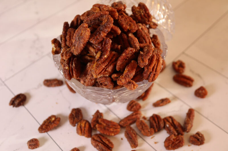 Spiced candied pecans in a serving dish.