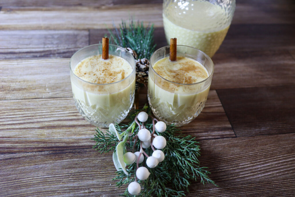 Eggnog in glasses garnished with spices.