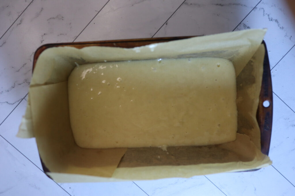 Pouring the batter into the loaf pan.