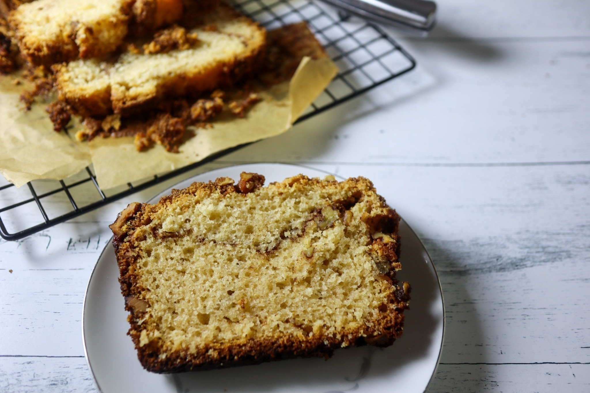 Gluten-free cinnamon walnut quick bread on a plate.