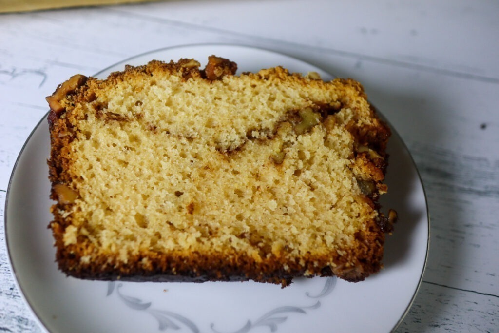 Gluten-free cinnamon walnut quick bread on a plate.