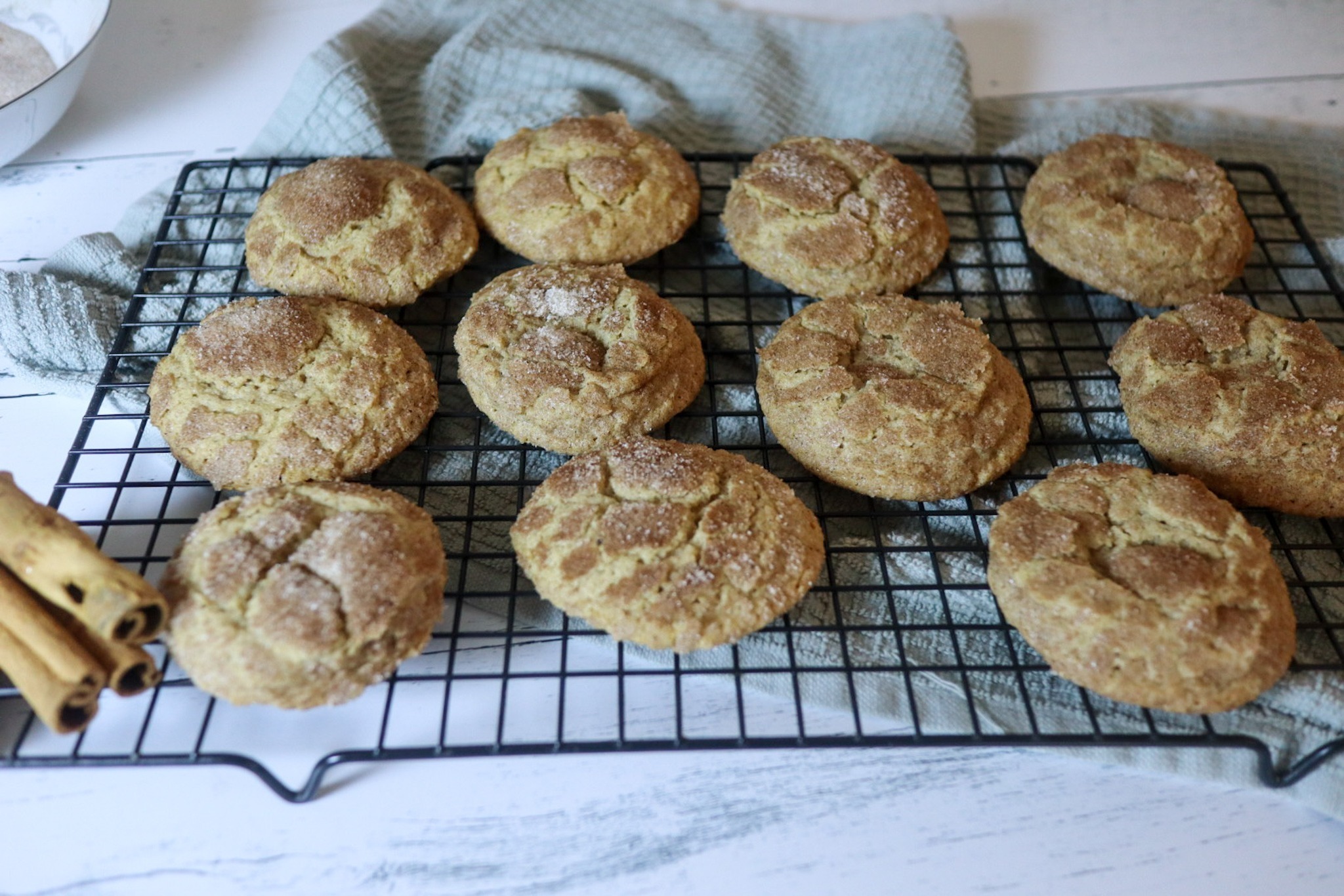 Gluten-free Snickerdoodles on a cooling rack.