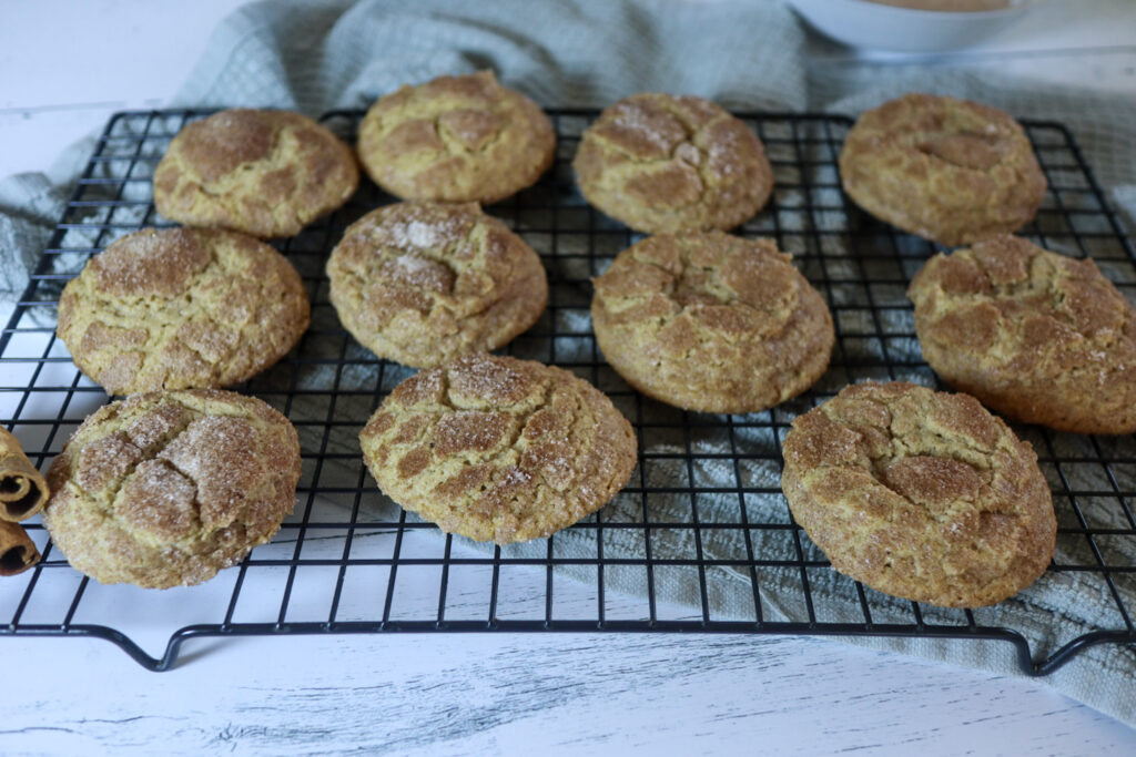 Gluten-free Snickerdoodles on a cooling rack.