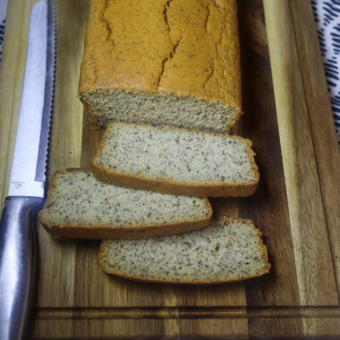 Slices of almond flour bread on a cutting board.