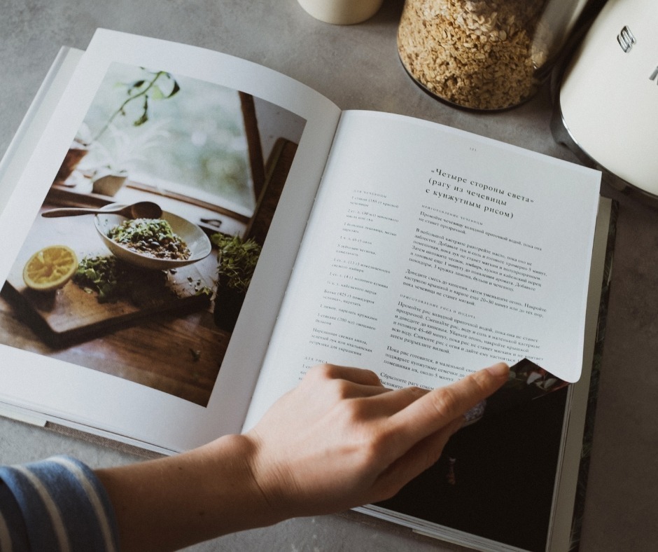 Someone reading a cookbook.