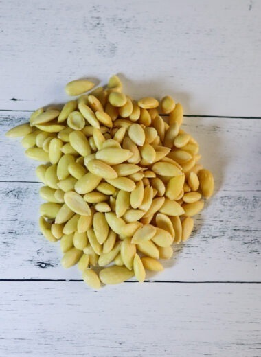 Blanched almonds and raw almonds.