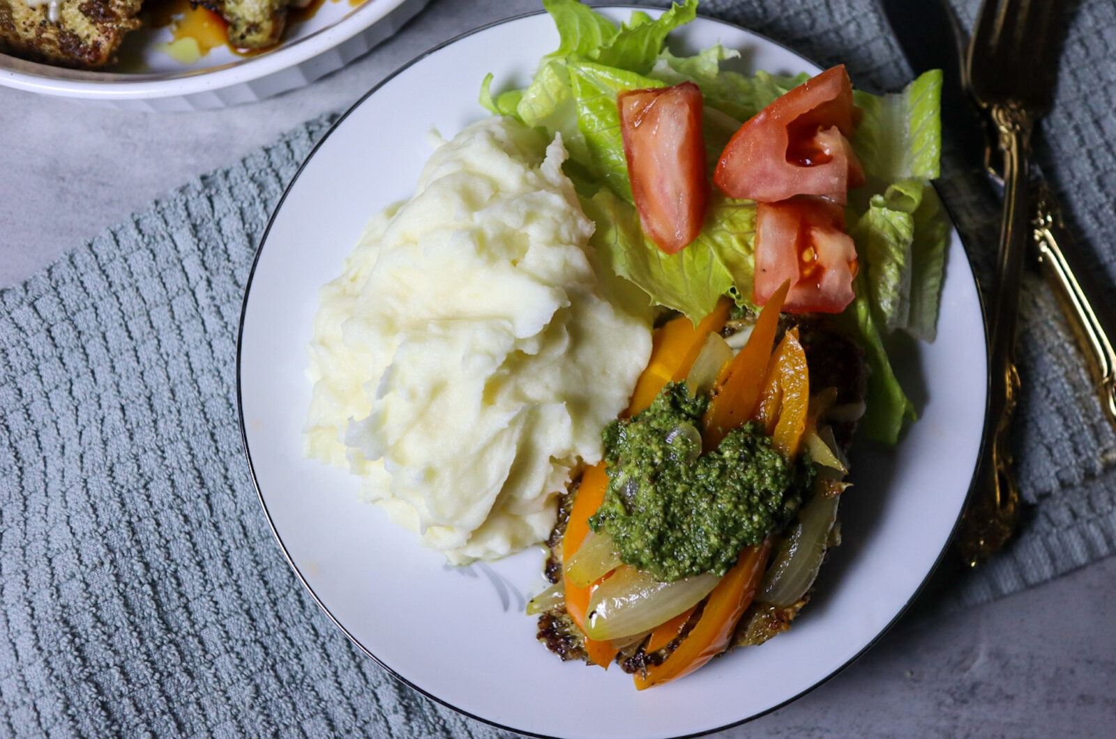 Cheesy Pesto Chicken With Sauteed Peppers & Onions