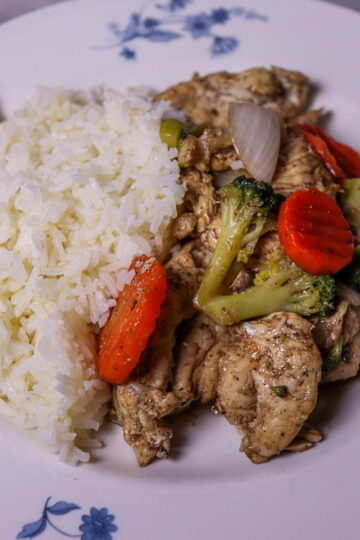 Chicken stir-fry served with white rice.