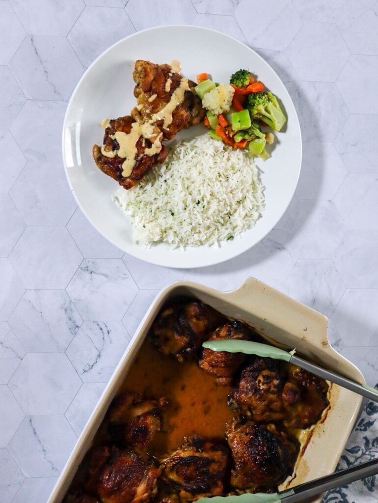 Crispy BBQ chicken with Alabama white BBQ sauce servedwith parsley rice and mixed vegetables.