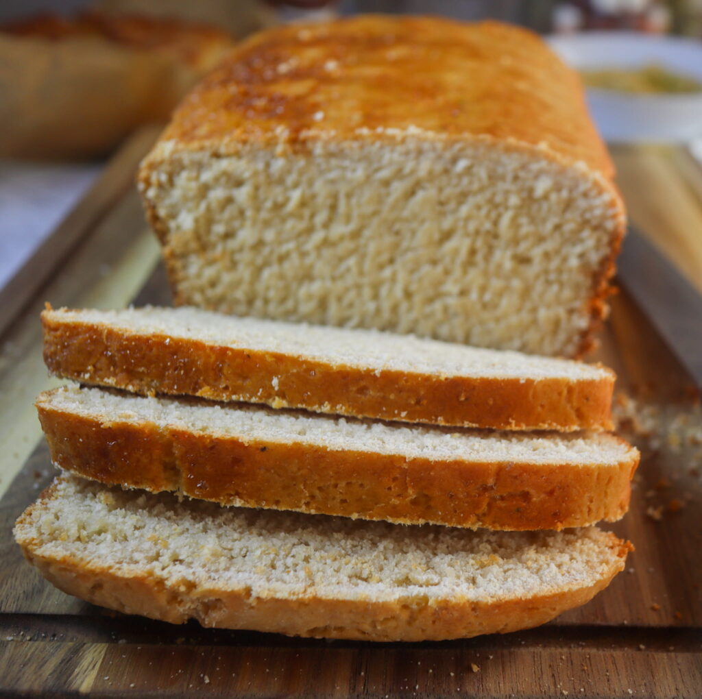 Gluten-free mashed potato bread on a cutting board.
