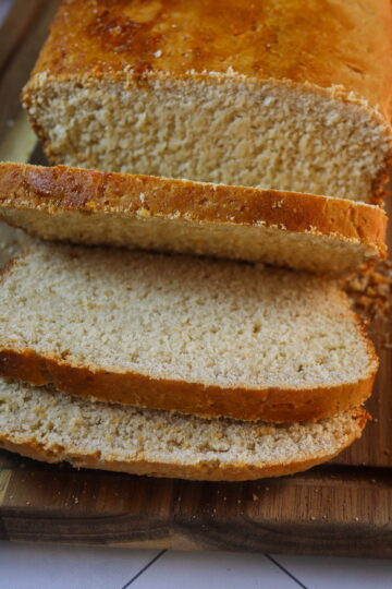 Gluten-free mashed potato bread on a cutting board.
