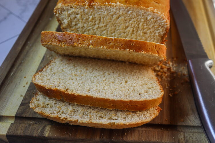 Gluten-free mashed potato bread on a cutting board.