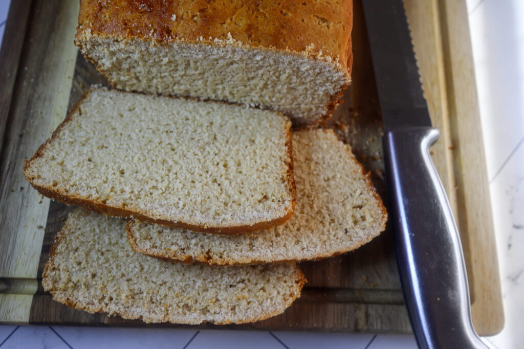 Gluten-free mashed potato bread on a cutting board.